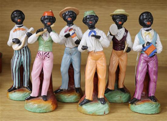 A band of six early 20th century Continental pottery black musicians, 18cm